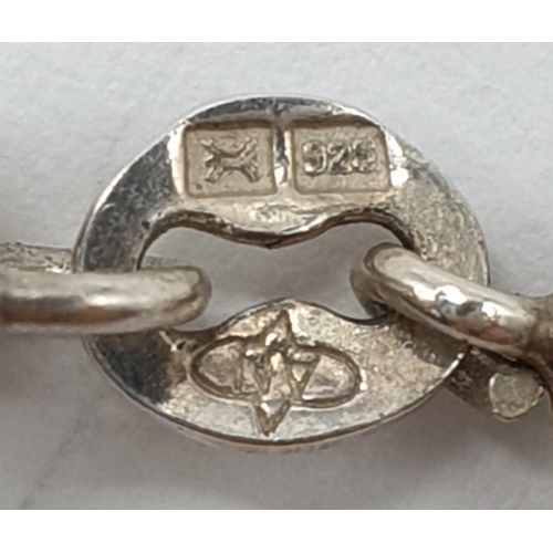 605 - A silver bracelet in byzantine design. 18.1 grams. 18cm length.