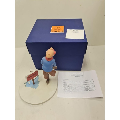 506 - A Tin Tin Herge Moulinsart model of Tin Tin avoiding broken ice. Good condition and comes with the b... 