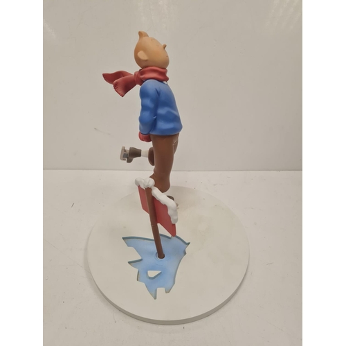 506 - A Tin Tin Herge Moulinsart model of Tin Tin avoiding broken ice. Good condition and comes with the b... 