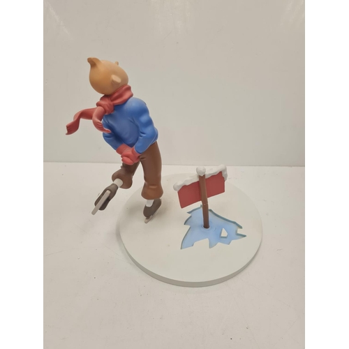 506 - A Tin Tin Herge Moulinsart model of Tin Tin avoiding broken ice. Good condition and comes with the b... 