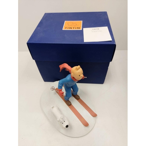 587 - A Tin Tin Herge Moulinsart model of Tin Tin skiing with Snowy. Good condition with box and comes wit... 