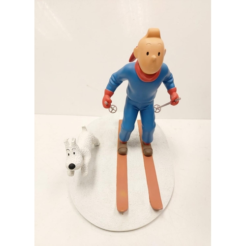 587 - A Tin Tin Herge Moulinsart model of Tin Tin skiing with Snowy. Good condition with box and comes wit... 