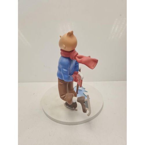 506 - A Tin Tin Herge Moulinsart model of Tin Tin avoiding broken ice. Good condition and comes with the b... 