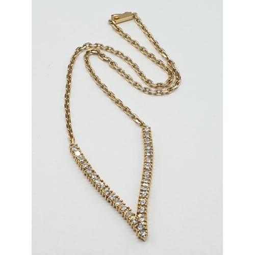 519 - 18CT YELLOW GOLD AND DIAMOND NECKLACE IN A V SHAPED DESIGNED, WEIGHT 21.4G AND 38CM LONG APPROX