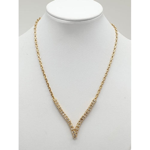 519 - 18CT YELLOW GOLD AND DIAMOND NECKLACE IN A V SHAPED DESIGNED, WEIGHT 21.4G AND 38CM LONG APPROX