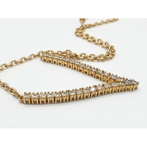 519 - 18CT YELLOW GOLD AND DIAMOND NECKLACE IN A V SHAPED DESIGNED, WEIGHT 21.4G AND 38CM LONG APPROX