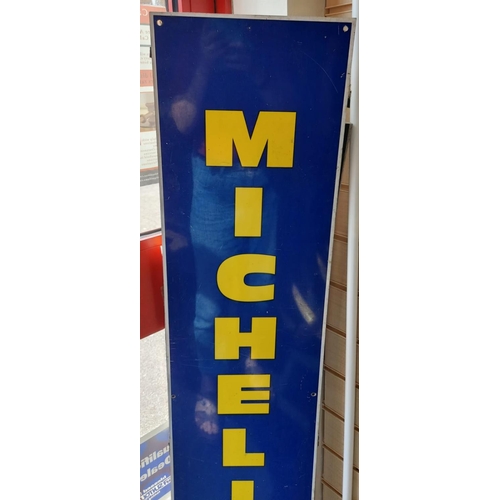 657 - A vintage 1960's aluminium Michelin tyres sign including the iconic 'Michelin Man'. Yellow print on ... 