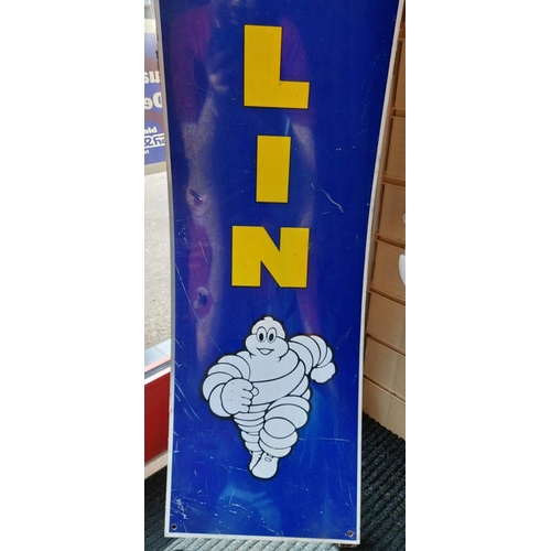 657 - A vintage 1960's aluminium Michelin tyres sign including the iconic 'Michelin Man'. Yellow print on ... 