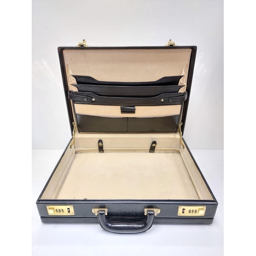 378 - A black leather briefcase with numerical locks in used condition.