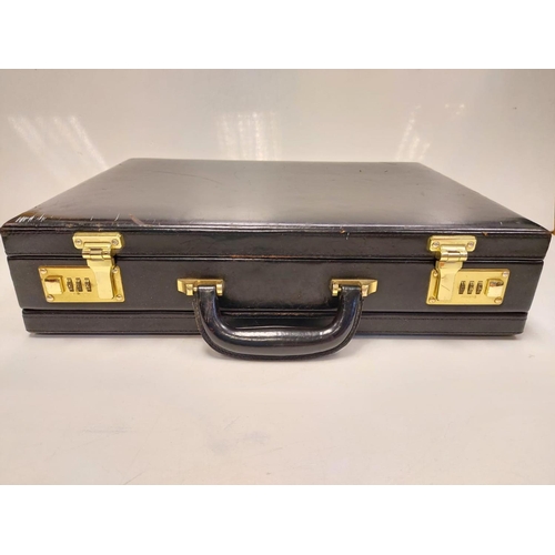 378 - A black leather briefcase with numerical locks in used condition.