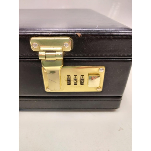 378 - A black leather briefcase with numerical locks in used condition.