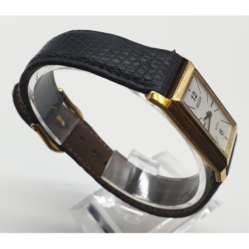 91 - Vintage ladies 18ct gold Jaeger watch in tank style with leather strap, 19x32mm case.