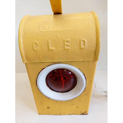 280 - A roadside, road works warming lamp. In working order - plug operated; with amber lens. 13cm x H43cm