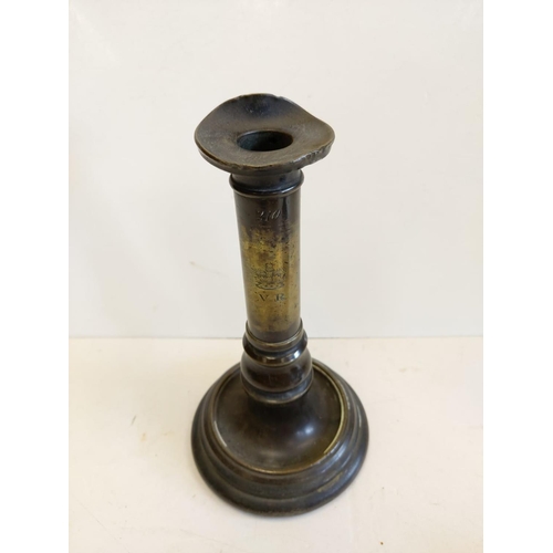 663 - A pair of Victorian brass candlesticks, engraved with VR next to crown. 22cm high.