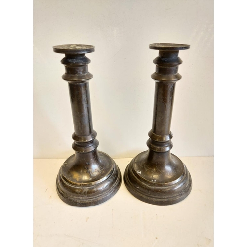 665 - A pair of Victorian brass candlesticks.