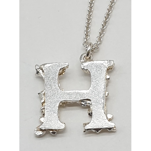 500 - Alex Monroe Floral Letter H Pendant & Chain in Sterling Silver, weight 3.2g and pendant 1.5cm long a... 