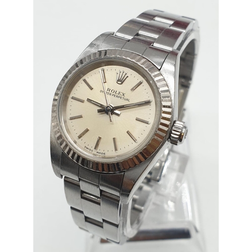 61 - Ladies Rolex Oyster Perpetual with champagne colour face and steel bracelet, 26mm case, with origina... 