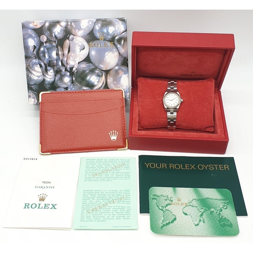 61 - Ladies Rolex Oyster Perpetual with champagne colour face and steel bracelet, 26mm case, with origina... 