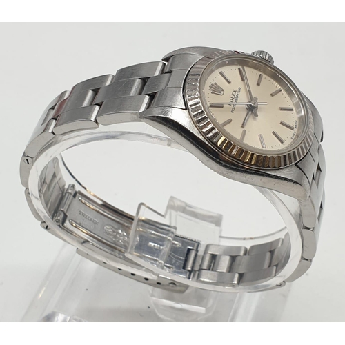 61 - Ladies Rolex Oyster Perpetual with champagne colour face and steel bracelet, 26mm case, with origina... 