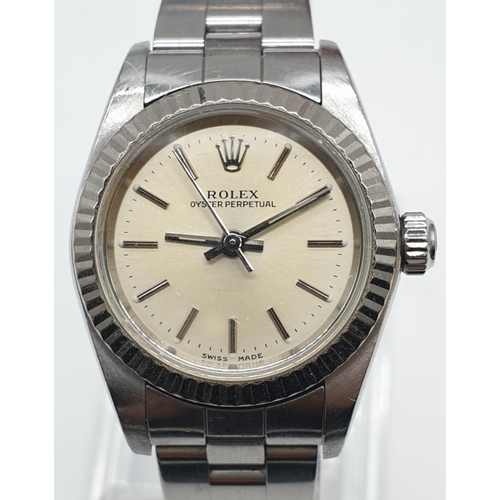 61 - Ladies Rolex Oyster Perpetual with champagne colour face and steel bracelet, 26mm case, with origina... 