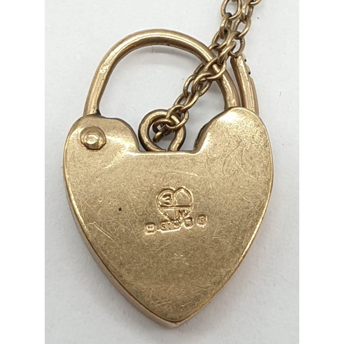 265 - 9ct yellow gold gate bracelet with heart padlock, weight 11.2g and 17cm long approx