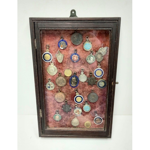 259 - A selection of 28 vintage and antique athletic medals from a wide array of associations. Well presen... 