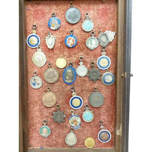 259 - A selection of 28 vintage and antique athletic medals from a wide array of associations. Well presen... 