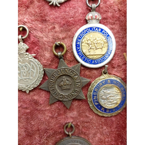 259 - A selection of 28 vintage and antique athletic medals from a wide array of associations. Well presen... 