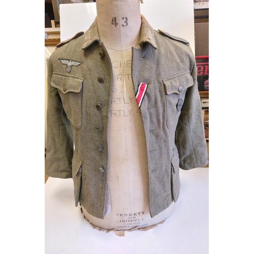 62 - German M42 Field Blouse. Maybe a re-enactors jacket or movie prop with original insignia and wound b... 