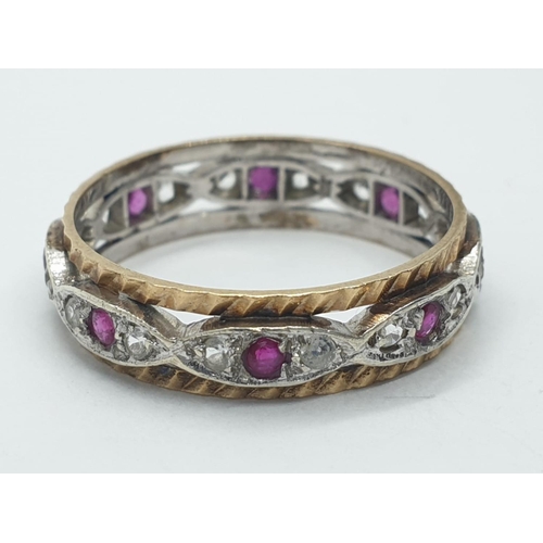 1009 - 9ct ruby and white sapphire eternity ring. 2.6g in weight. Size  O.