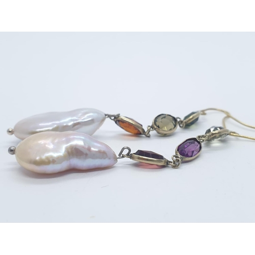 1004 - A pair of baroque pearl and tourmaline earrings. Weight 6.8g.