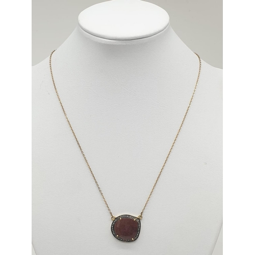 1005 - 9ct Gold natural ruby and diamond necklace. 4.2g in weight, 40cm in length.