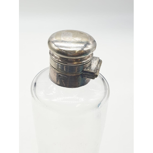 169 - A vintage conical hunting saddle flask with silver plate lid. 18cm high.