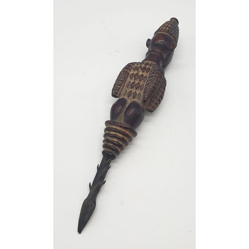 186 - A vintage wooden African ceremonial dagger. 34cm long.