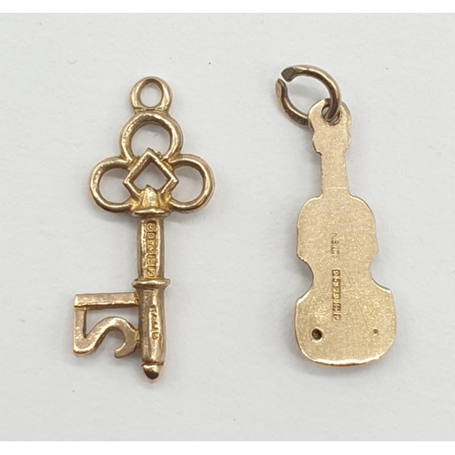 324 - Two 9ct gold pendants. '21' Key and Violin. 2cm in length. Weight 1.23g