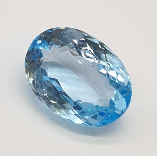 379 - A 17.33 Cts Blue topaz. Oval mixed cut. IDT certification included.