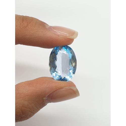 379 - A 17.33 Cts Blue topaz. Oval mixed cut. IDT certification included.