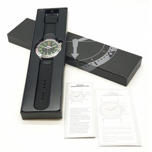 546 - A new and unused 1980's Russian tank watch with original instructions and box.