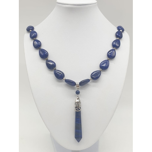 103 - A tear drop shaped lapis lazuli necklace and earrings with long obelisks. Necklace length: 54cm, ear... 