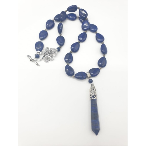 103 - A tear drop shaped lapis lazuli necklace and earrings with long obelisks. Necklace length: 54cm, ear... 