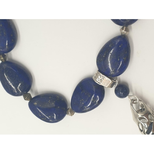 103 - A tear drop shaped lapis lazuli necklace and earrings with long obelisks. Necklace length: 54cm, ear... 