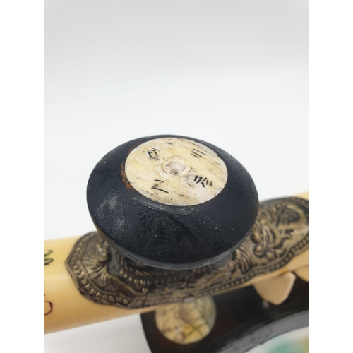 85 - An antique Chinese opium pipe, made of water buffalo bone,  on a custom  made base made of wood and ... 