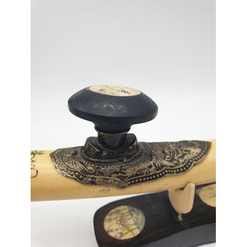 85 - An antique Chinese opium pipe, made of water buffalo bone,  on a custom  made base made of wood and ... 