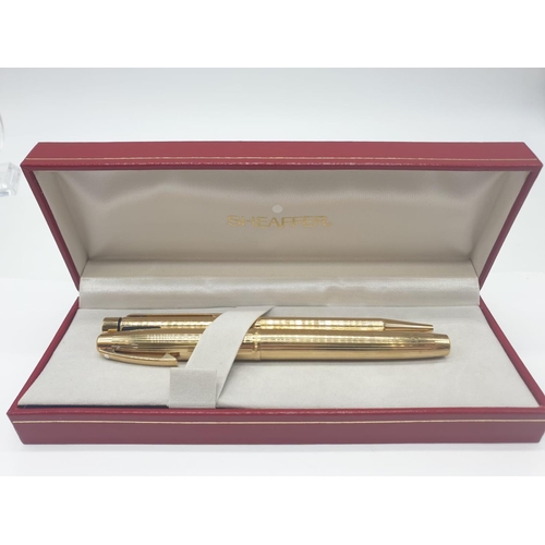 89 - A late 70’s American Sheaffer,  gold electroplated, fountain pen and pen in original box. With parts... 