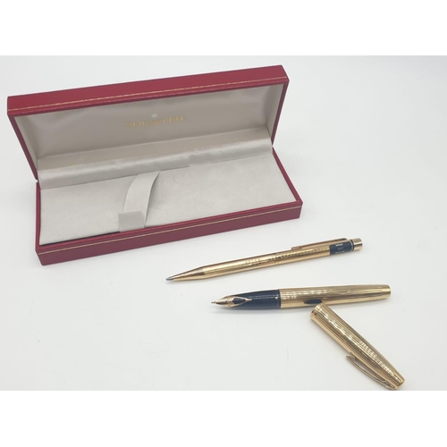 89 - A late 70’s American Sheaffer,  gold electroplated, fountain pen and pen in original box. With parts... 