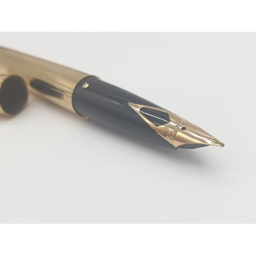 89 - A late 70’s American Sheaffer,  gold electroplated, fountain pen and pen in original box. With parts... 