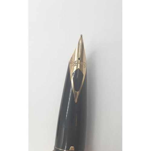 89 - A late 70’s American Sheaffer,  gold electroplated, fountain pen and pen in original box. With parts... 