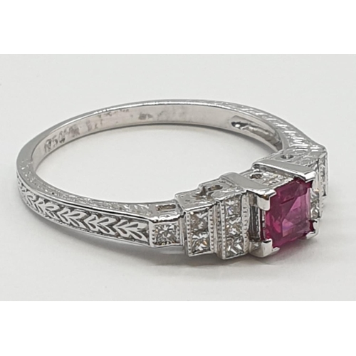 113 - An art deco style ladies 18ct white gold diamond and ruby (emerald cut) ring. Size N.0.3ct ruby. Tot... 