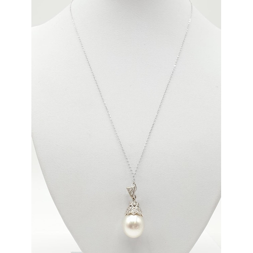 706 - South Sea pearl PENDANT with Diamonds .  18ct chain.  7.6g  40cm