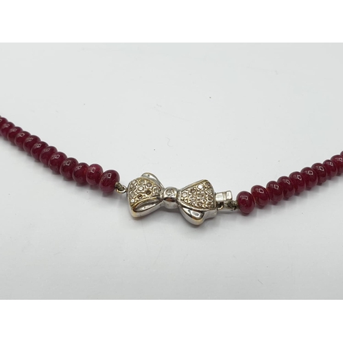 812 - Diamond and Ruby NECKLACE with 18ct gold clasp.   15.9g    40cm